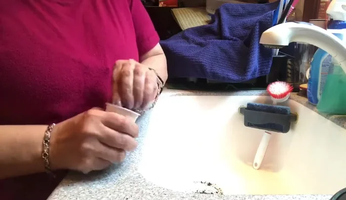 Tear off the filter at the bottom of each K-cup. Start from a corner for easier removal.