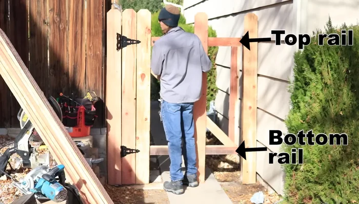 Cut the top and bottom rails 1 inch shorter than the smallest post distance measurement.