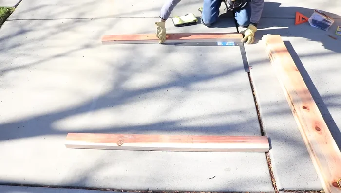 Square up the rails using diagonal measurements. Temporarily screw them to a workbench for stability if possible.