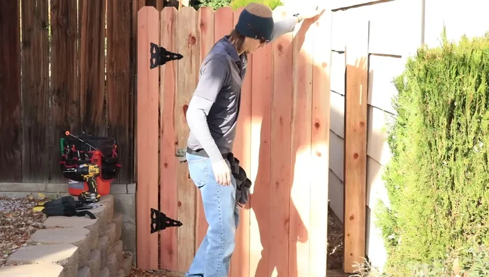 Trim the bottom of the gate if it rubs the ground.