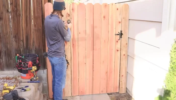 Install a handle (optional). Secure all remaining screws for the pickets and brace.