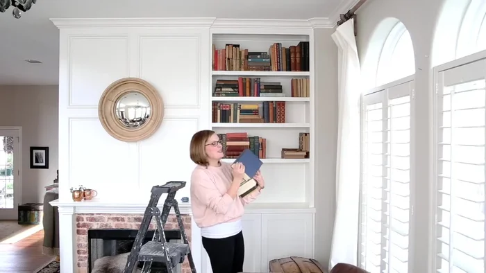 Incorporate seasonal colors: Select decorative items with colors that complement the spring theme. In this case, blues and greens are chosen.