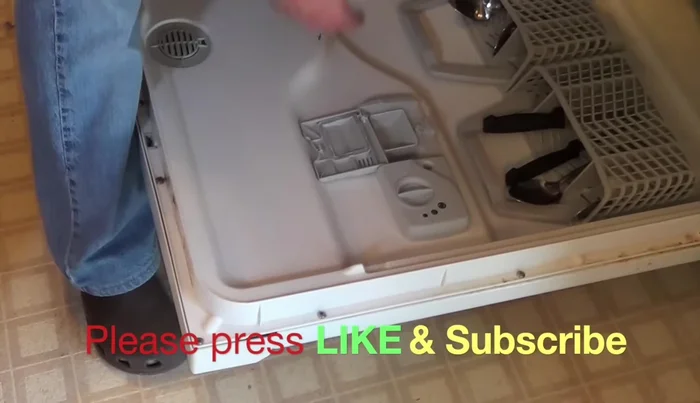 Remove approximately 11 screws from the inside of the dishwasher door using a Torx bit screwdriver.