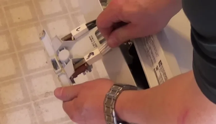Install the new latch, ensuring the wires are reconnected correctly (match the L and R markings).