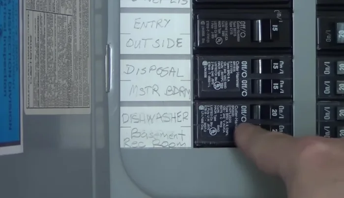 Turn off the power to the dishwasher by finding its circuit breaker in your breaker box and turning it off.