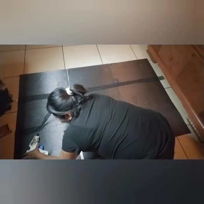 Attach strips to the back: After drying, flip the rug over and glue the remaining shelf liner strips to the back to secure all the placemats.