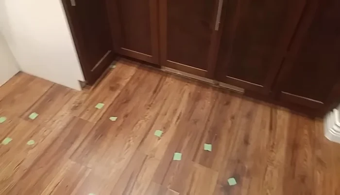 Remove the trim and kickboards: Carefully pry off the trim and kickboards using a pry tool.