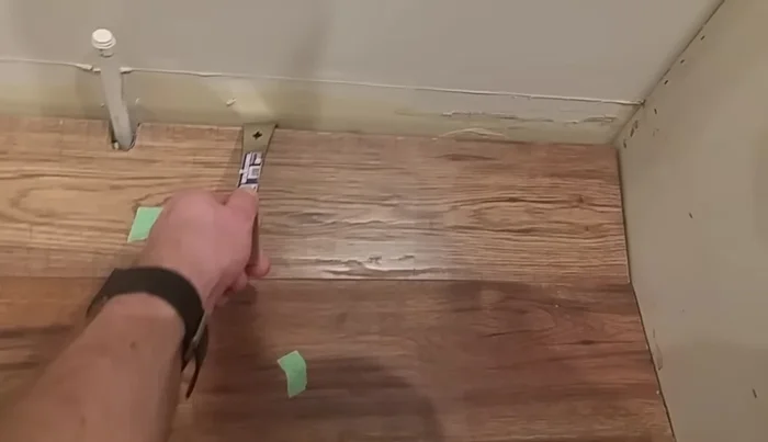 Address stubborn boards (if applicable): If a board is difficult to remove because it’s held by another board, remove the adjacent board first. For boards under obstructions, consider using a suction cup to lift the board slightly before carefully tapping it free. Note any damaged areas for later repair.