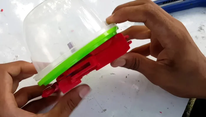 Further adjustments may be needed to ensure the launcher fits properly within the container.