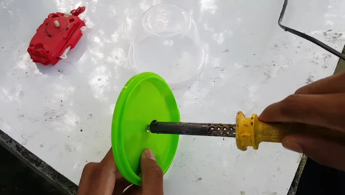 Further adjustments may be needed to ensure the launcher fits properly within the container.