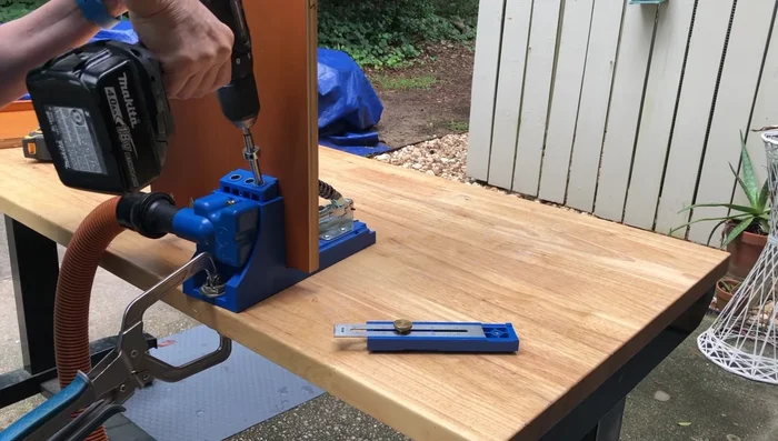 Construct bed frame sides: Cut and assemble shelving pieces using pocket holes and screws. For corners, use bevel cuts for a cleaner look.