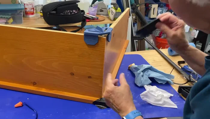 Assemble frame corners: Glue and brad nail, using clamps and tape to hold pieces in place while drying. (Avoid using corner blocks; L-brackets offer a lower profile and better functionality)
