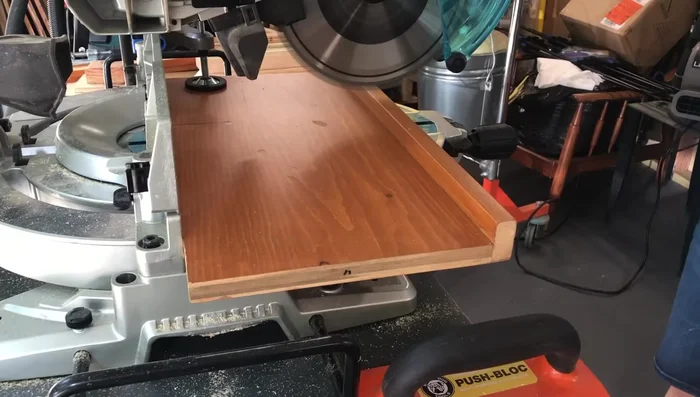 Cut and attach front and side pieces: Measure and cut shelving to fit the frame's front and sides. Attach using pocket holes and screws.