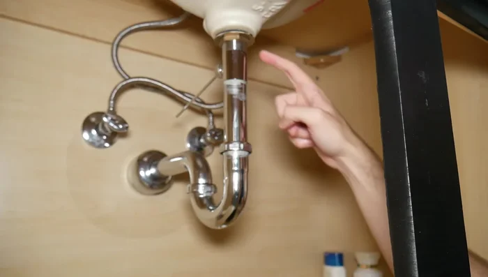 Remove the bottom bit of the old drain (to reuse the tailpiece for the U-pipe connection).