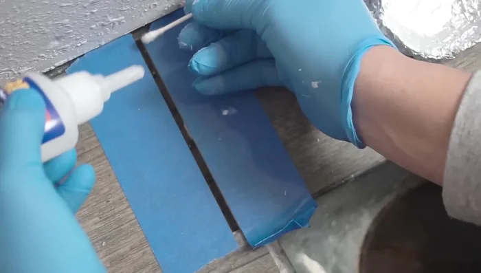 Insert the replacement plank into the gap and tap it into place using a mallet and suction cup.