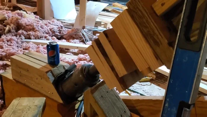 Installing 2x8 support beam to correct the sag.