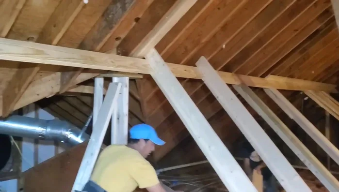 Verifying the repair: Checking for levelness and straightness.