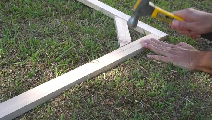 Add nails for threading: Add small nails along the frame perimeter at 6-inch intervals to serve as anchors for the thread.