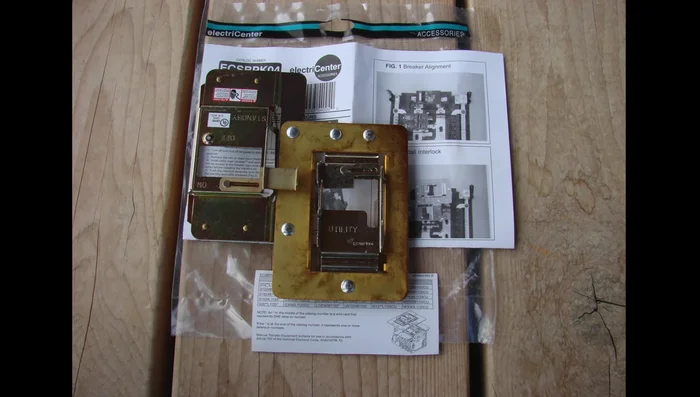 After connecting the generator circuit breaker, install the interlock device onto the circuit breakers. Ensure the panel cover is off during this process.