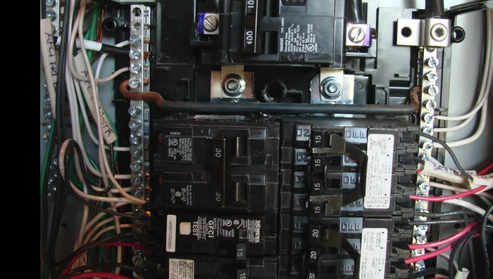 Install a generator circuit breaker with the same amperage rating as your generator (in this case, 30 amps). Connect the generator's hot wires (black and red, supplying 240 volts) to this breaker.