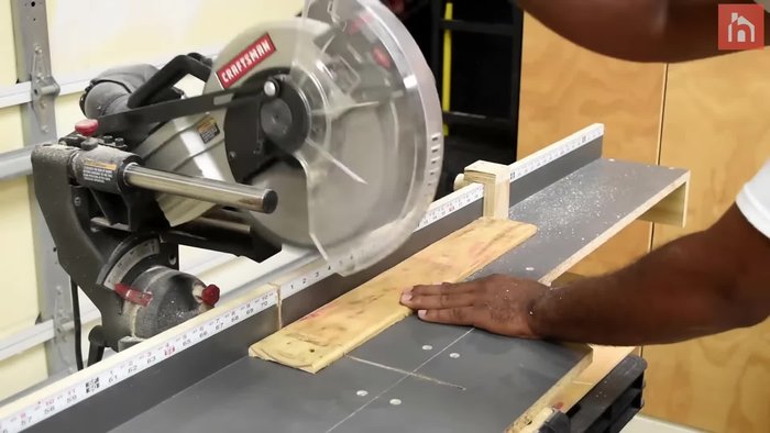 Sand the rough pallet surfaces.