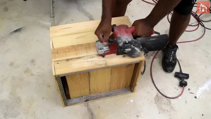 Sand the rough pallet surfaces.