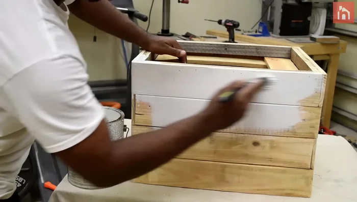 Paint the planter box, caulk and fill nail holes and cracks.