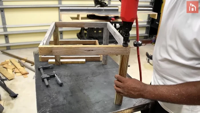 Attach pieces of wood in the corners to determine the planter box's height.