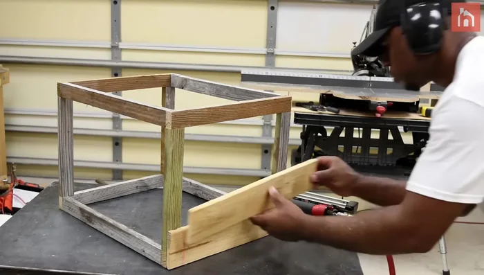 Attach pallets to the frame, offsetting every other board for interlocking strength.
