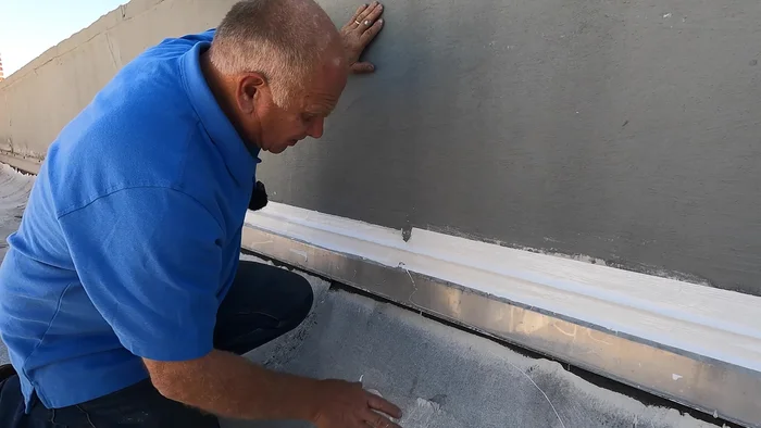 Prepare the area. Remove any loose or damaged caulking, and carefully scrape away any paint that doesn't adhere well to the wall around the flashing (about 2 inches).