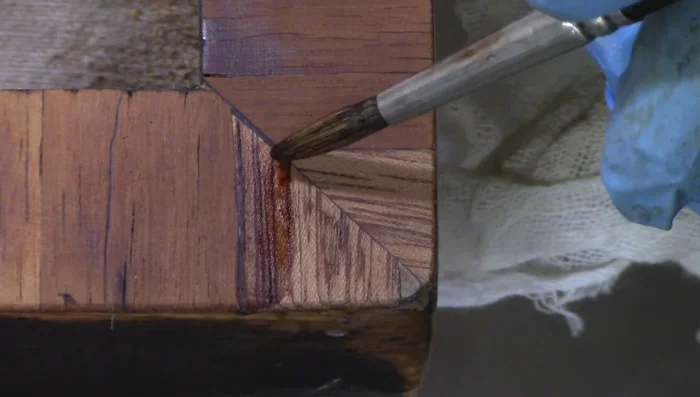 Spray with aerosol shellac to build up the finish.