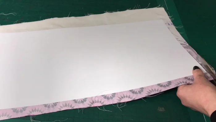 Cut Excess Fabric: Trim away the excess fabric around the PVC sheet.