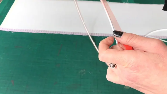 Attach Rings: Remove the tape backing and attach the rings to the edges of the PVC-covered fabric. Press firmly to ensure adhesion.