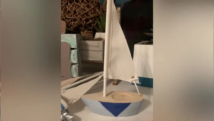 Upcycling Target dollar spot boats with vintage teal chalk paint.