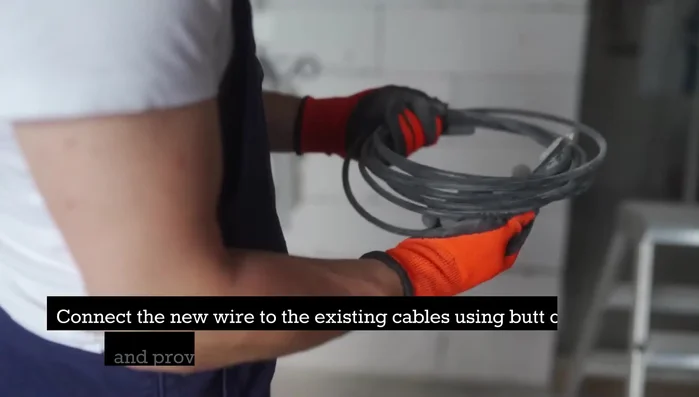 Connect the new wire to the existing cables using butt connectors and provide extra protection with heat shrink tubing.