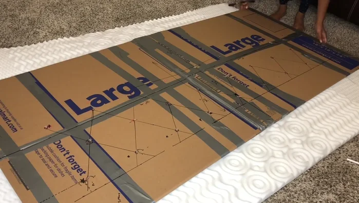 Add batting: Cut and staple batting to the back of the padded headboard base.