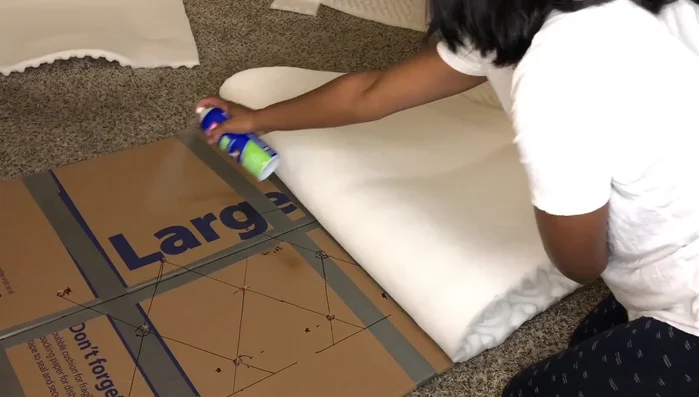 Add batting: Cut and staple batting to the back of the padded headboard base.