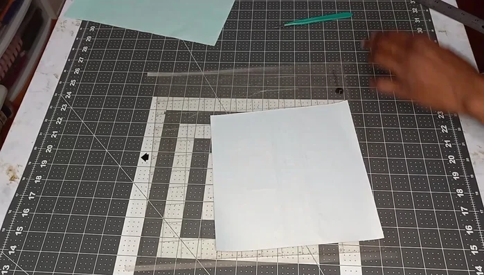 Weed out the excess vinyl from the cut design. Keep the design on the cutting mat for stability during weeding.