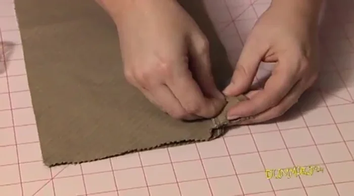 Sew the entire cut edge (don't sew the hemmed edge). Use a running stitch by hand or a straight stitch with a machine.