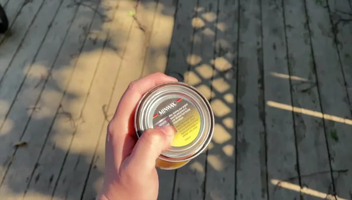 Stain the wooden sign.