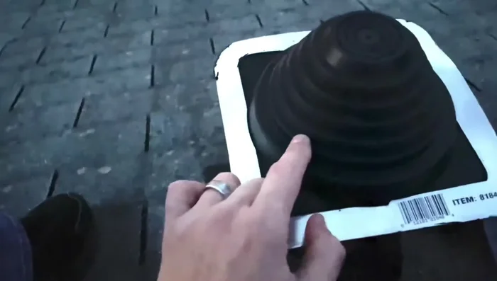 Cut the rubber boot to the appropriate size to fit over the septic pipe.