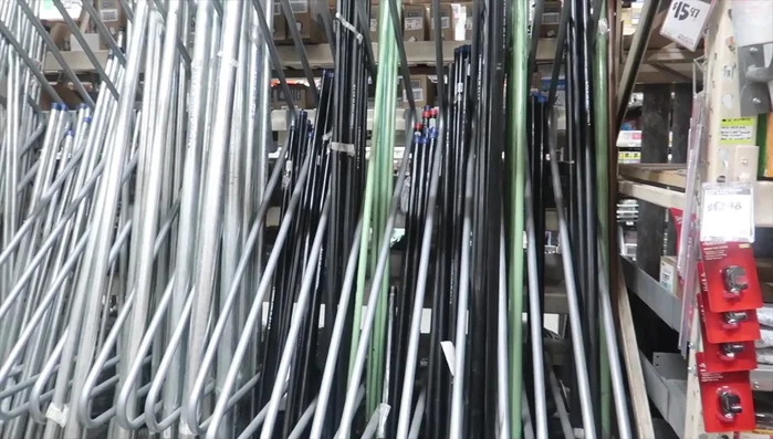 Assemble the complete curtain rod and attach it to the wall brackets.