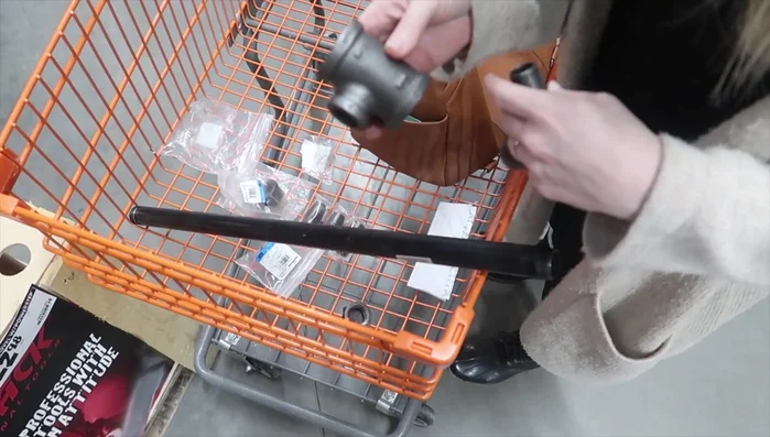 Attach 1-inch to 1/2-inch reducer T and 1/2-inch flange plate to the ends of the pipe.