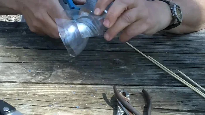 Use scissors to form a collar around the screw cap portion, trimming it even with the scissors to create a feeding port.