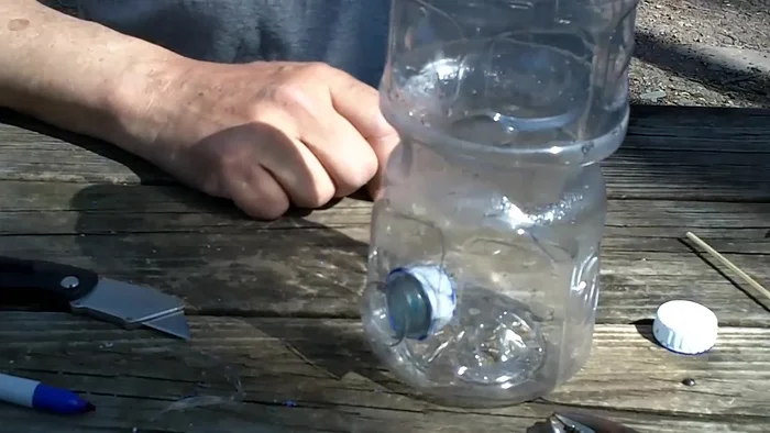 Drill a 1/8 inch hole just below the feeding port on both sides.