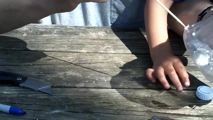 Insert a dowel (e.g., barbecue skewer) through the holes to create a perch for the birds.