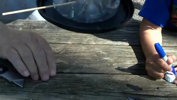 Drill a few holes in the coffee can lid to allow rainwater to drain.