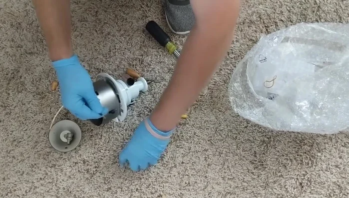 Tuck the wires neatly inside the housing and secure the light kit.