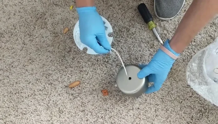 Tuck the wires neatly inside the housing and secure the light kit.