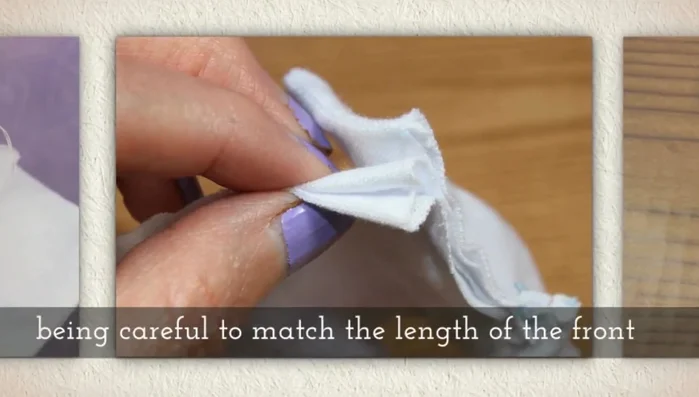 Fold the raw edges of the front inside, matching the length with the back. Whip stitch along the bottom of the shirt's front.